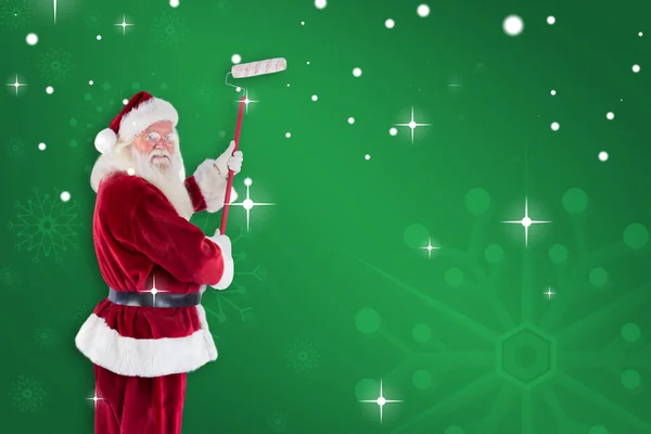 Father Christmas paints wall — Stock Photo, Image