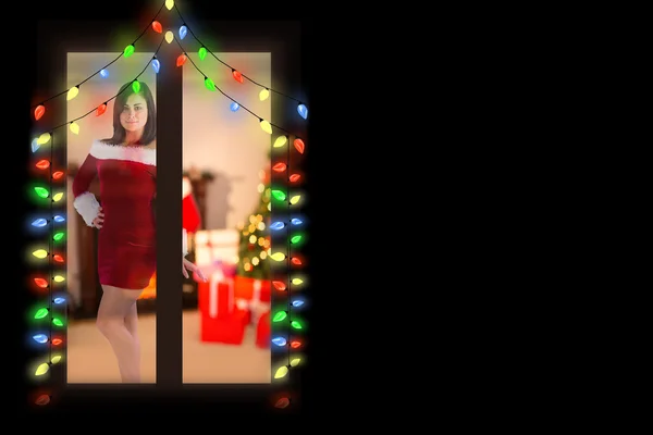 Mooi meisje glimlachend in santa outfit — Stockfoto