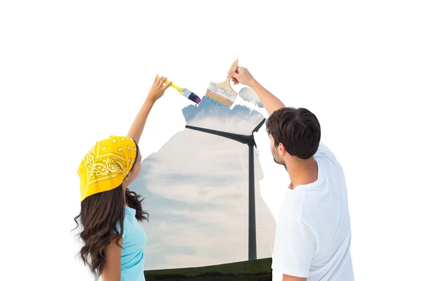 Jovem casal pintando um céu — Fotografia de Stock