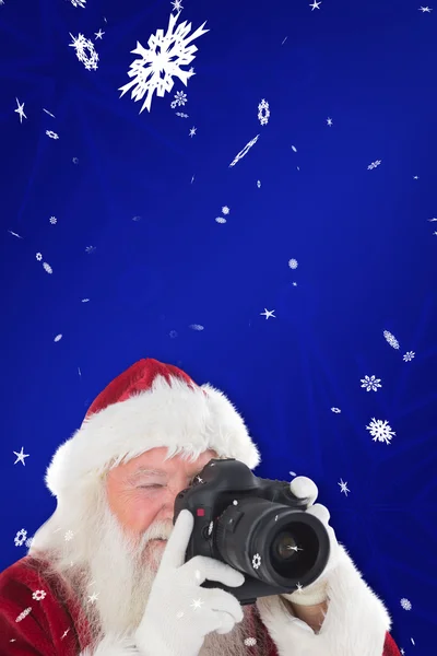 Santa is het nemen van foto — Stockfoto