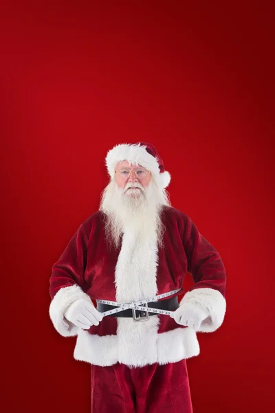 Santa Claus maatregelen zijn buik — Stockfoto