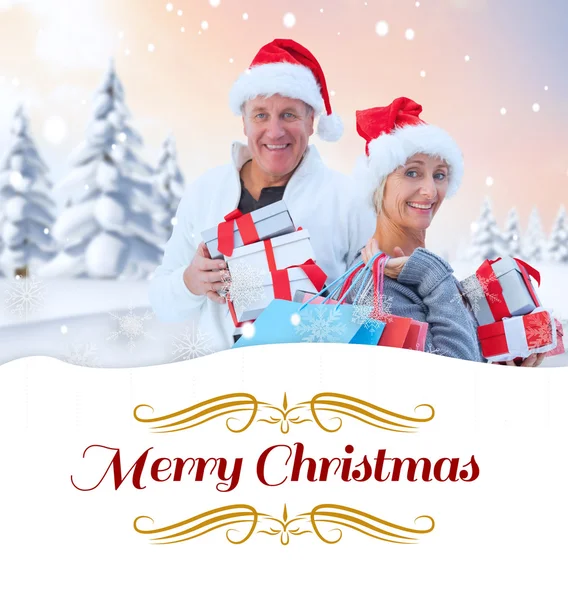 Couple with shopping bags and gifts — Stock Photo, Image