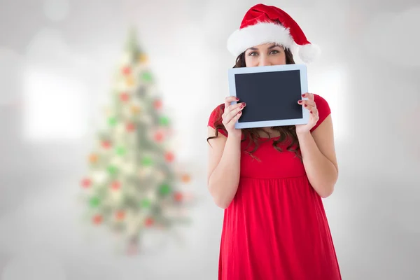 Kompositbild einer festlichen Brünette mit einem Tablet — Stockfoto