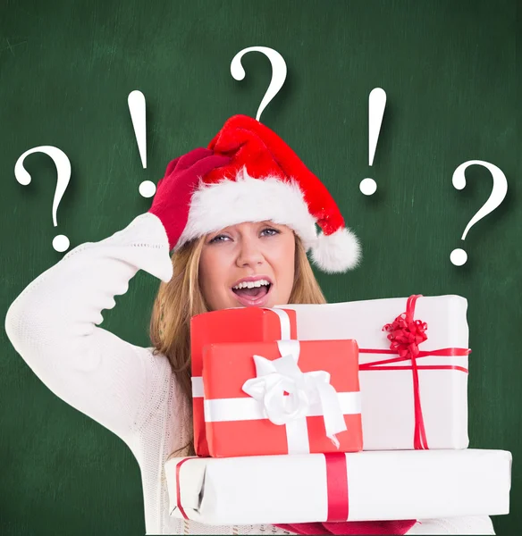 Festive blonde holding pile of gifts — Stock Photo, Image