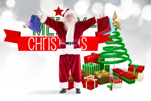 Santa holds some bags for Chistmas — Stock Photo, Image