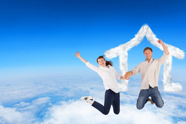 Couple jumping and holding hands — Stock Photo, Image