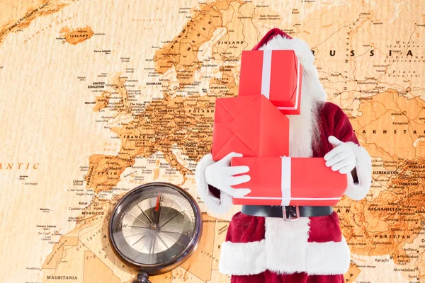 Santa covers his face with presents — Stock Photo, Image