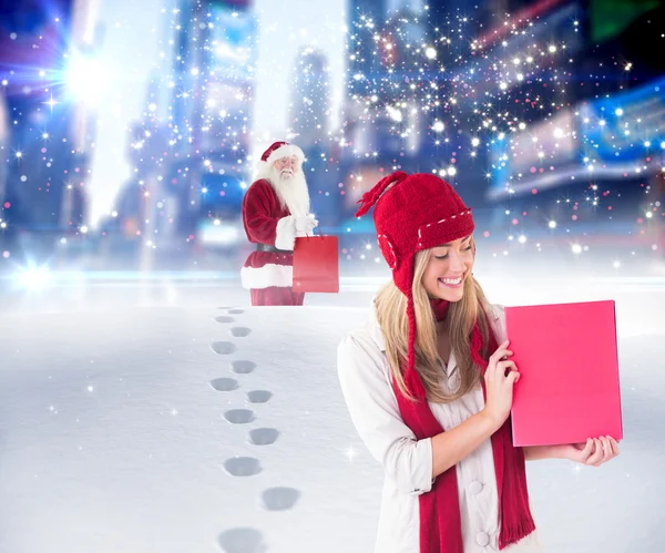 Festive blonde shopping online with laptop — Stock Photo, Image