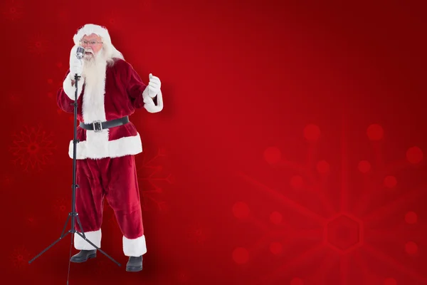 Santa sings like a superstar — Stock Photo, Image