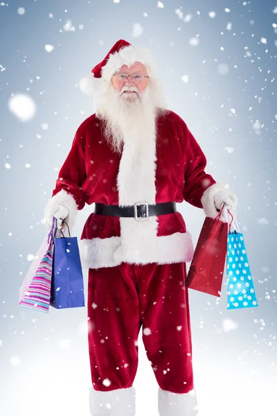 Babbo Natale porta alcune borse di Natale — Foto Stock