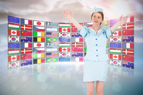 Pretty air hostess with arms raised — Stock Photo, Image