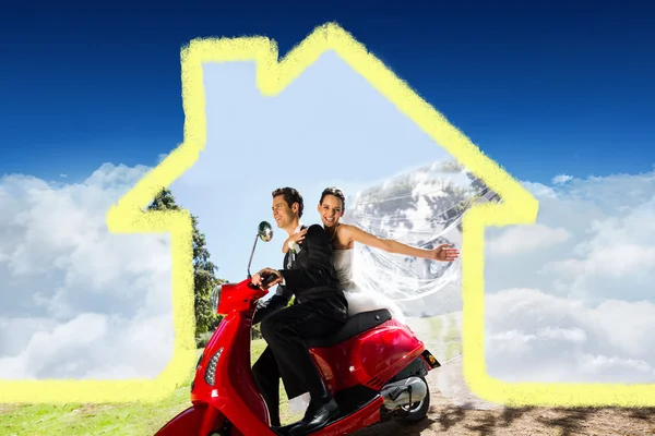 Cnewlywed couple enjoying scooter ride — Stock Photo, Image