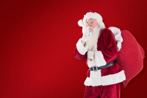 Santa, žádá o klid s taškou — Stock fotografie