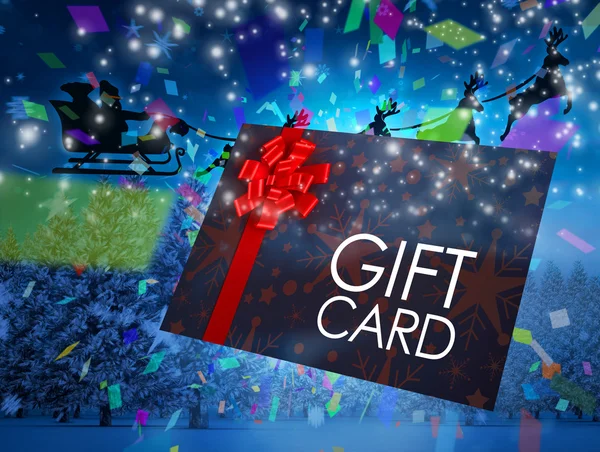 Santa flying behind gift card — Stock Photo, Image