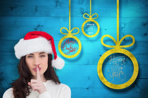 Festive brunette keeping a secret — Stock Photo, Image