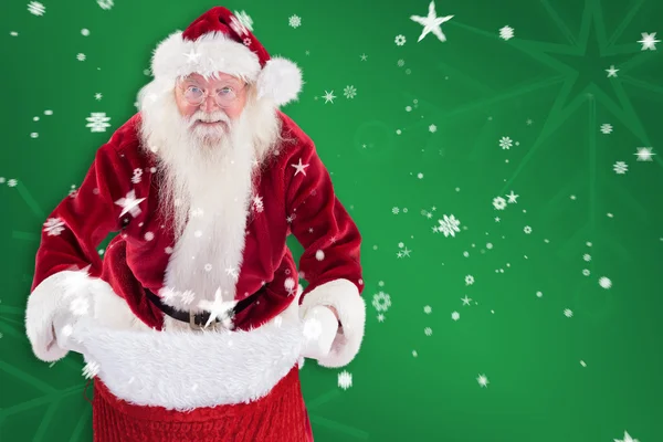 Weihnachtsmann öffnet seine rote Tasche — Stockfoto