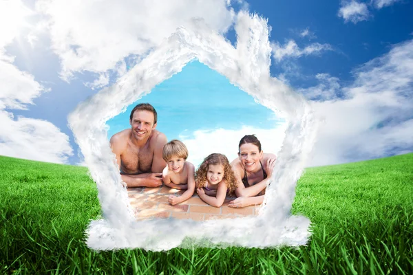 Happy family beside the swimming pool — Stock Photo, Image