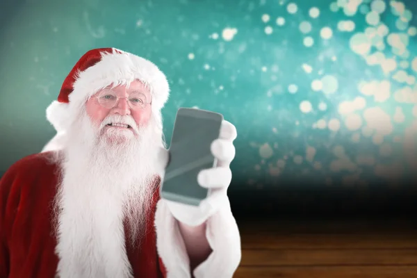 Santa Claus pokazuje smartphone — Zdjęcie stockowe