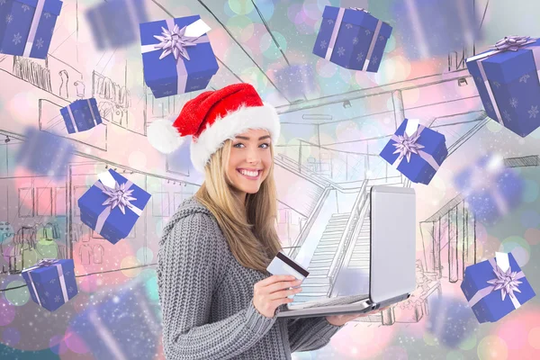 Festive blonde shopping online — Stock Photo, Image