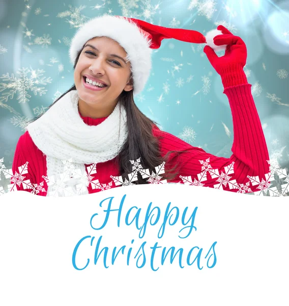 Composite image of festive brunette — Stock Photo, Image