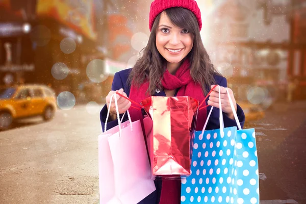 Brunette opening gift bag — Stock Photo, Image