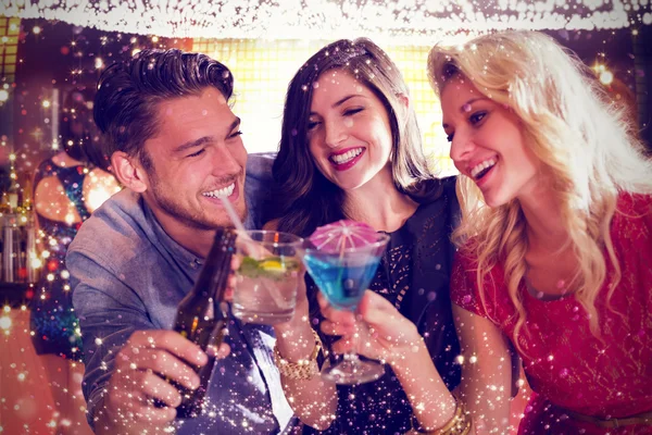 Composite image of friends with drinks — Stock Photo, Image