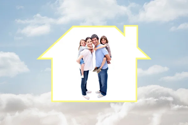 Jolly parents giving their children a piggyback — Stock Photo, Image