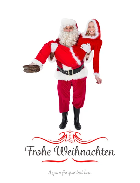 Weihnachtsmann und Frau Claus lächeln in die Kamera — Stockfoto