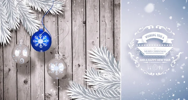 Christmas baubles hanging over wood — Stock Photo, Image