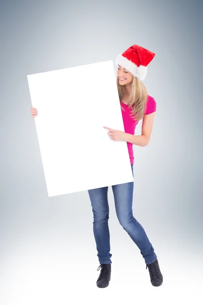 Festive blonde holding large poster — Stock Photo, Image