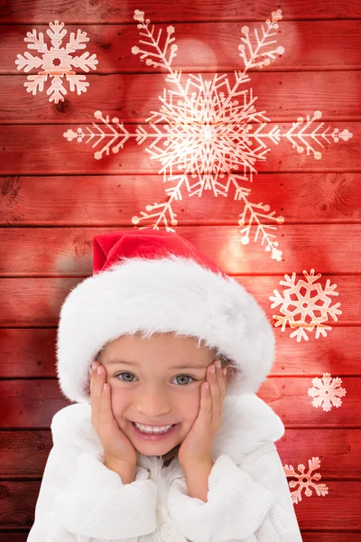 复合图像的可爱的小女孩，穿上圣诞老人的帽子 — 图库照片