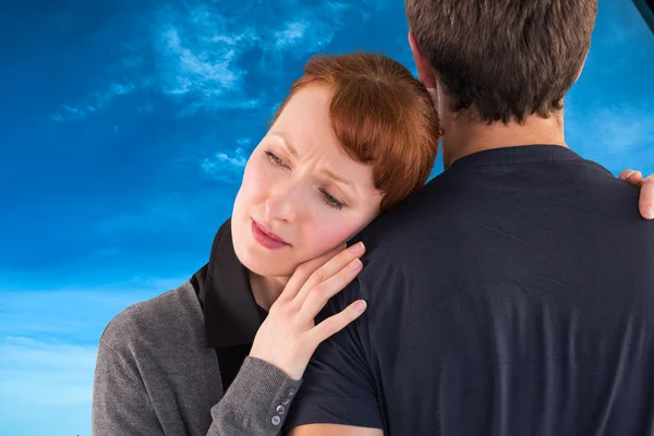 Scared woman holding onto man — Stock Photo, Image