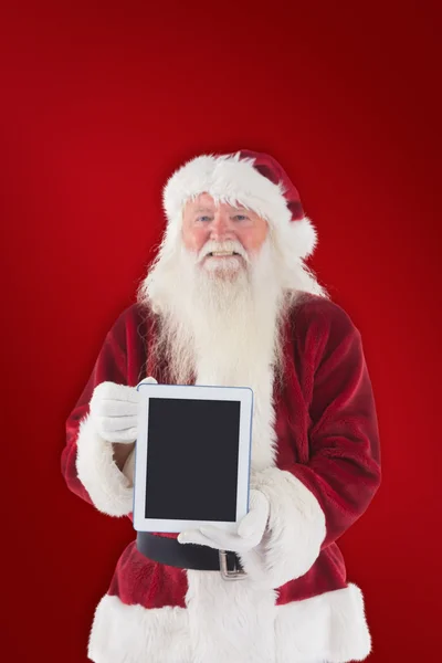 Weihnachtsmann präsentiert Tablet-PC — Stockfoto