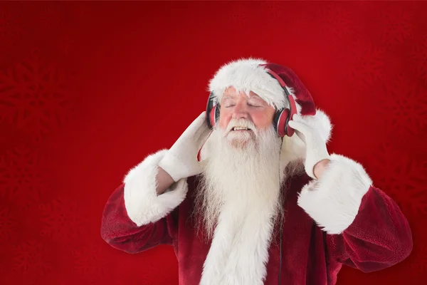 Weihnachtsmann genießt etwas Musik — Stockfoto