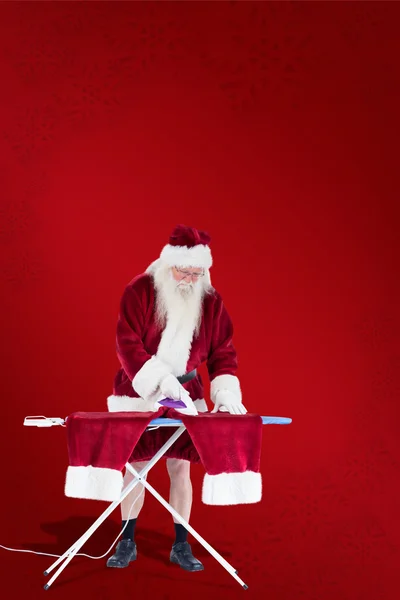 Santa is ironing his pants — Stock Photo, Image