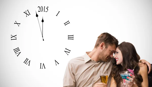 Composite image of cute couple drinking — Stock Photo, Image