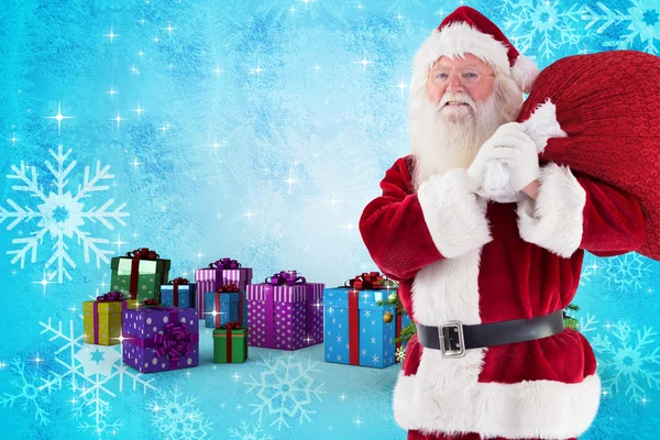 Santa carries his red bag and smiles — Stock Photo, Image