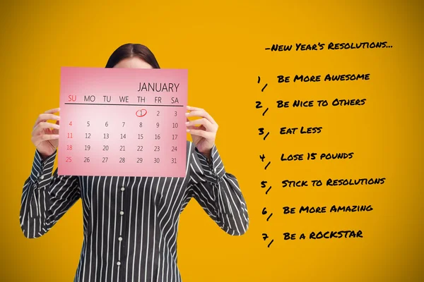 Geschäftsfrau zeigt einen Kalender — Stockfoto