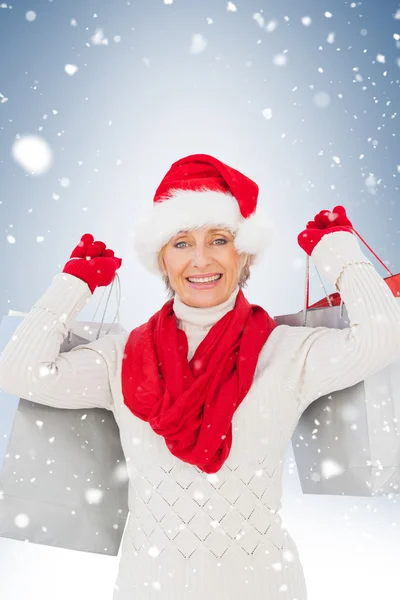 Festive woman holding shopping bags — Stock Photo, Image