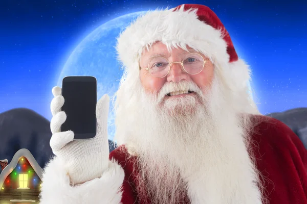 Weihnachtsmann zeigt Smartphone — Stockfoto