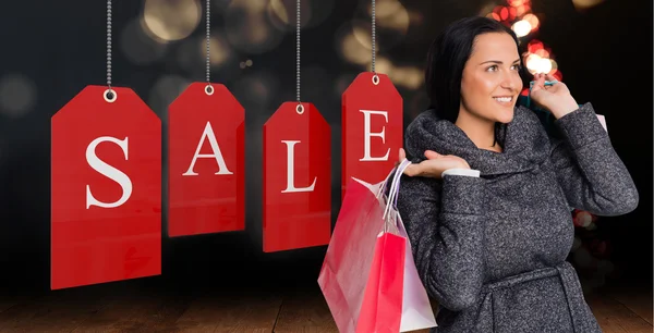 Sonriente mujer sosteniendo bolsa — Foto de Stock