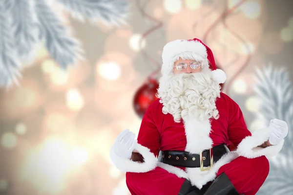 Papai Noel sentado em pose de lótus — Fotografia de Stock