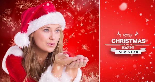 Festive blonde blowing over hands — Stock Photo, Image