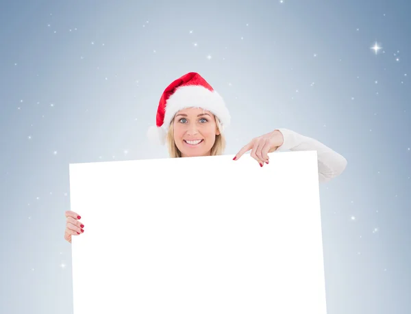 Festive blonde showing white poster — Stock Photo, Image