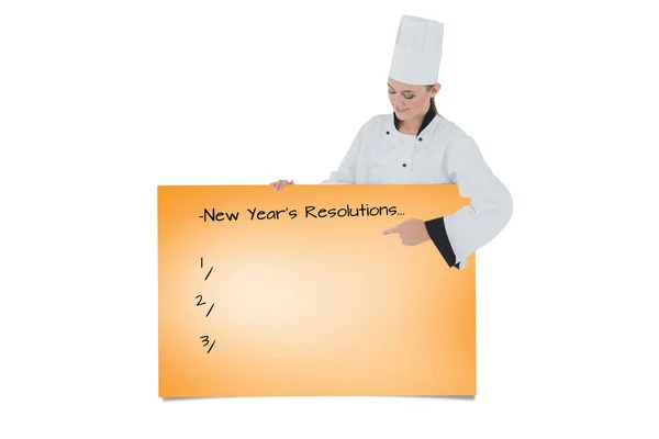 Composite image of female chef pointing on billboard — Stock Photo, Image