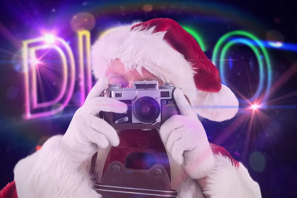 Weihnachtsmann macht Foto — Stockfoto