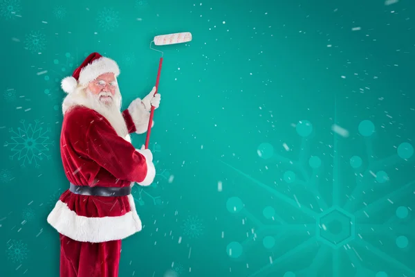 Father Christmas paints wall — Stock Photo, Image