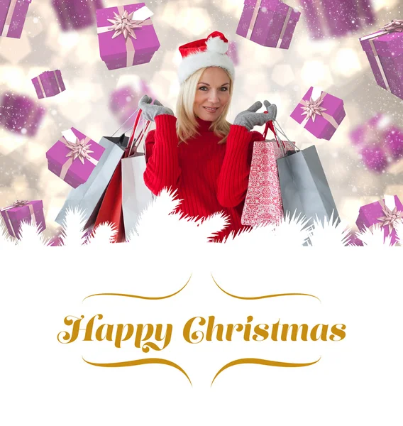 Festive blonde with shopping bags — Stock Photo, Image