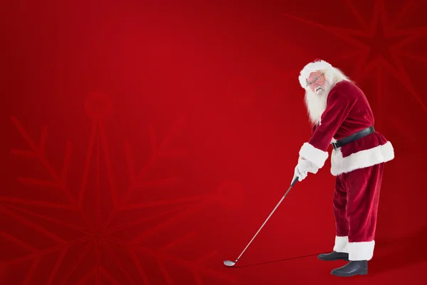 Santa Claus spelar golf — Stockfoto