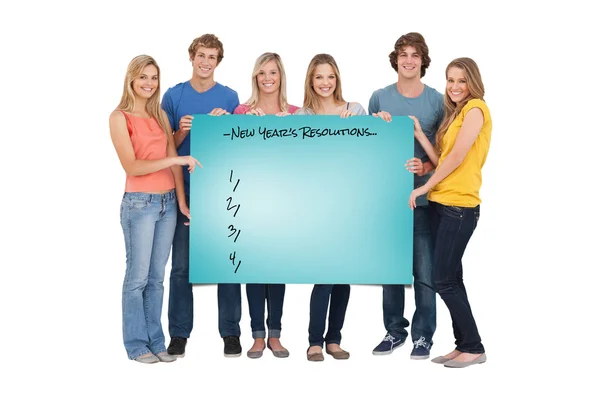 Group of people holding blank sheet — Stock Photo, Image